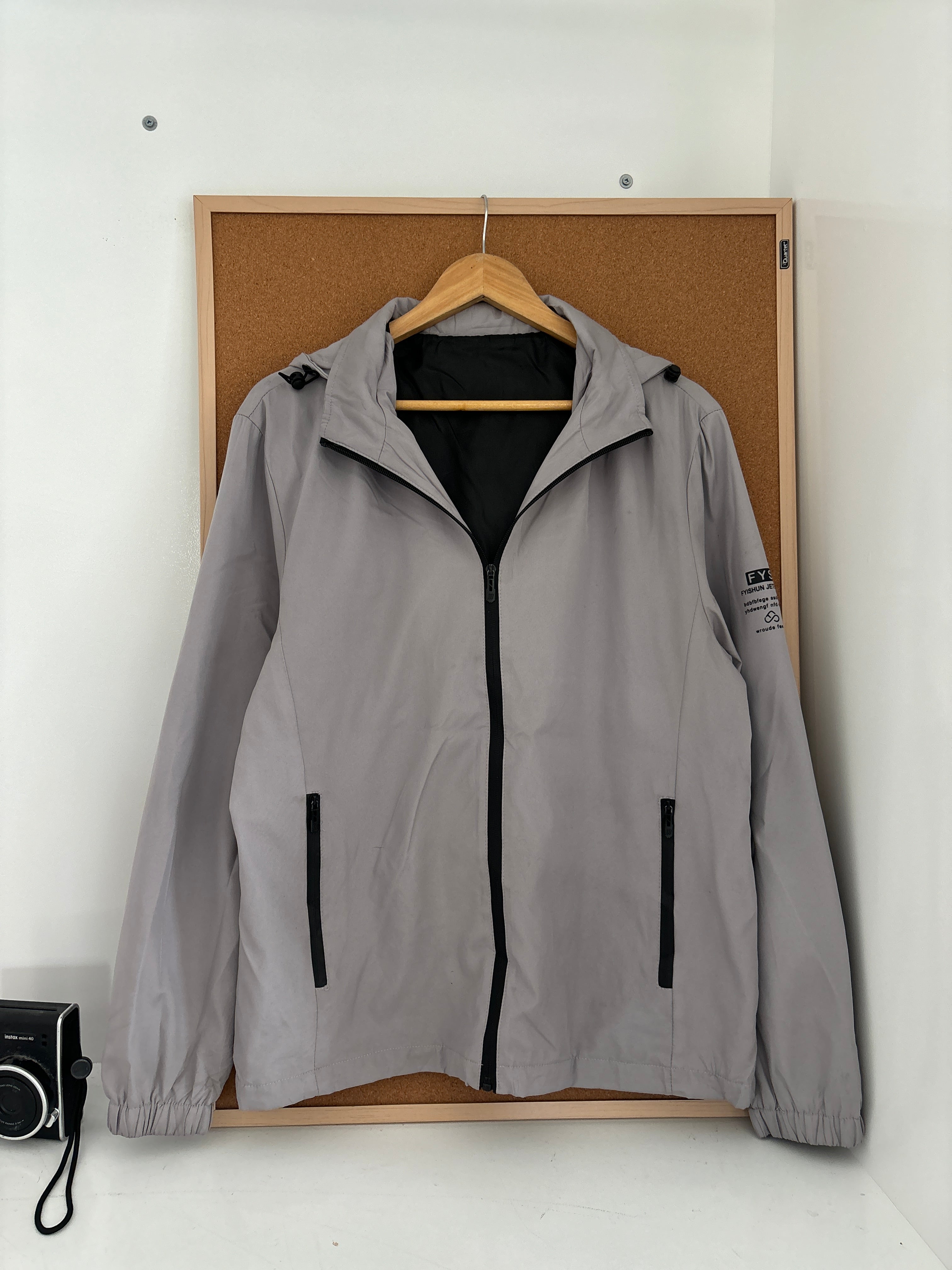 light grey hooded windbreaker