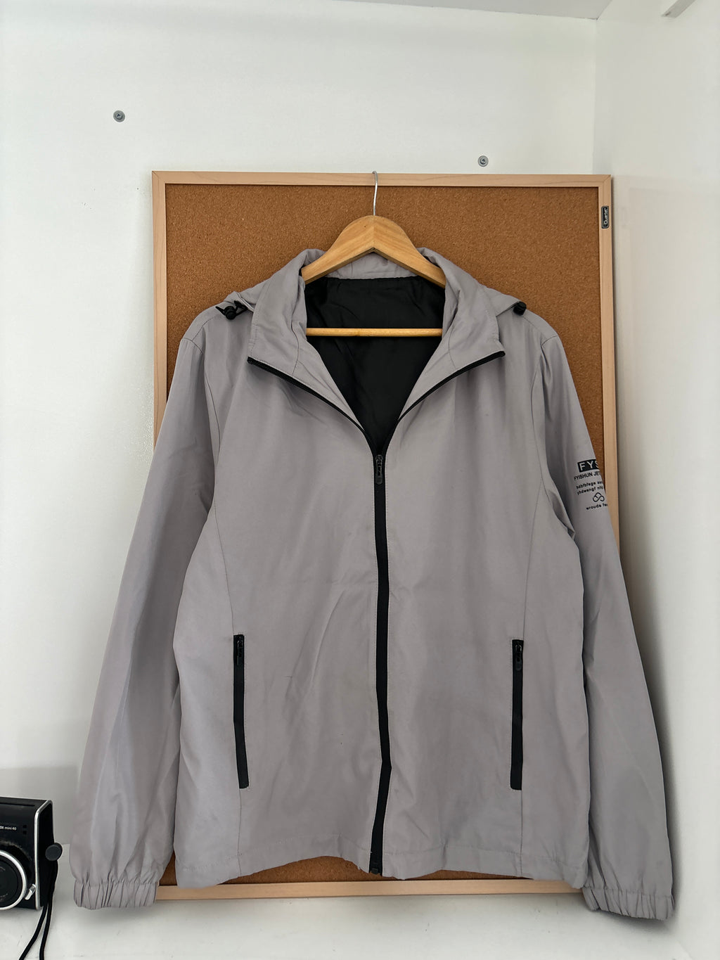light grey hooded windbreaker