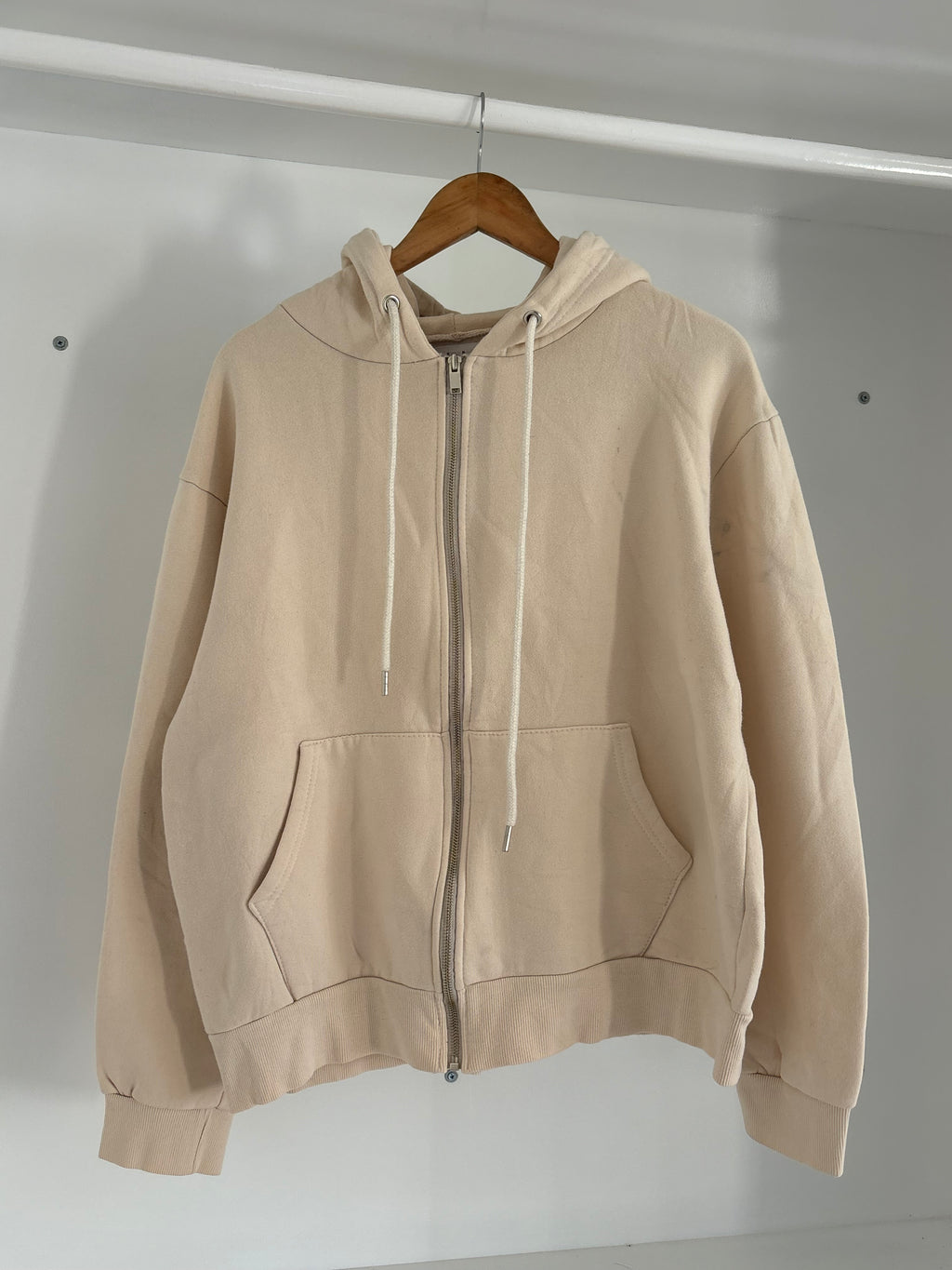 Beige zipper hoodie.