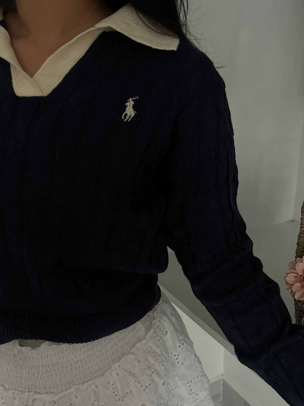 Polo sweater.